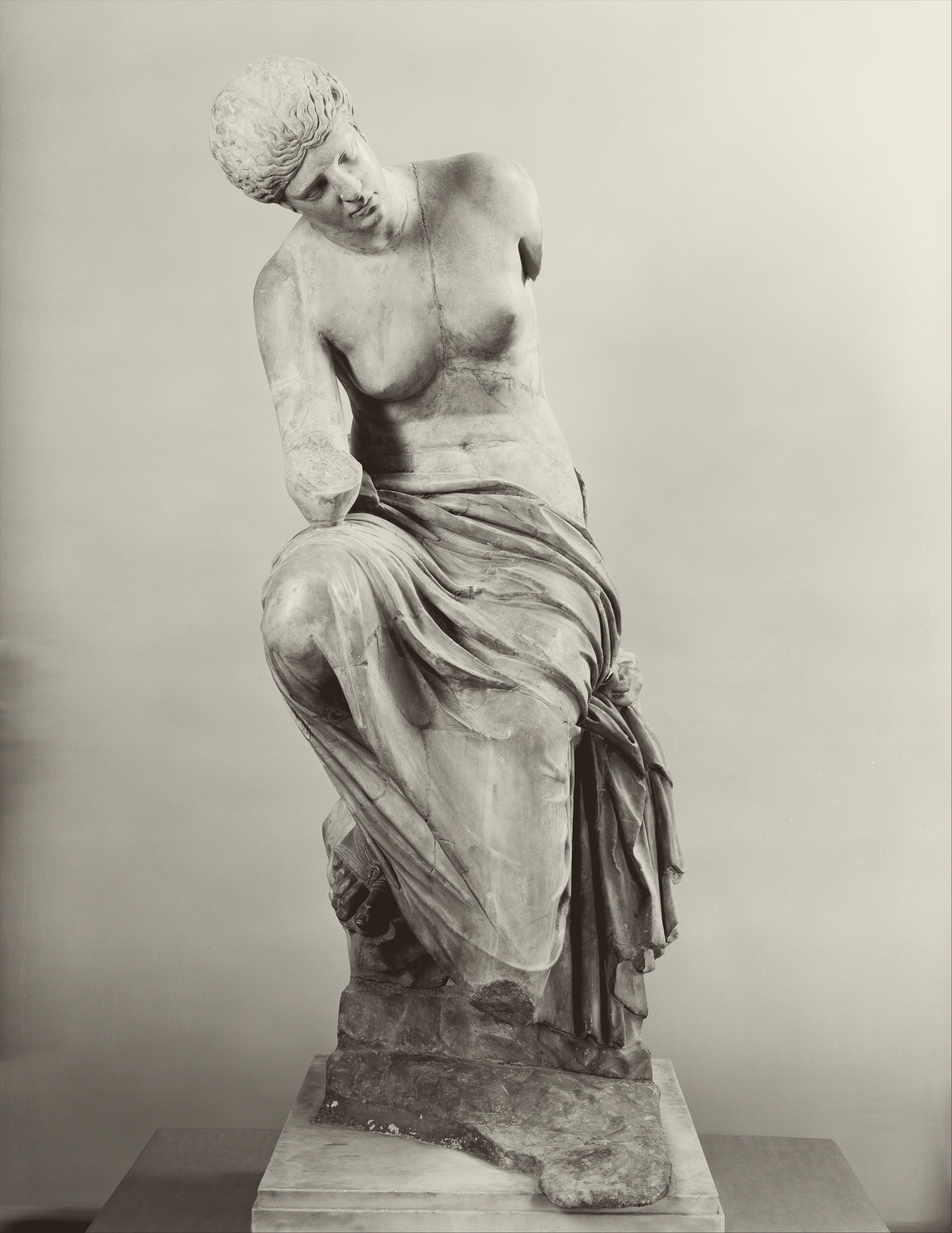 Marble statue of a seated muse. Roman, 1st or 2nd century CE